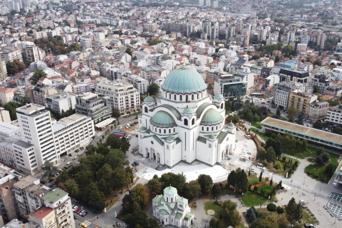 Aerial view of the Church of Saint Sava rising above the rooftops of Vračar in central Belgrade.