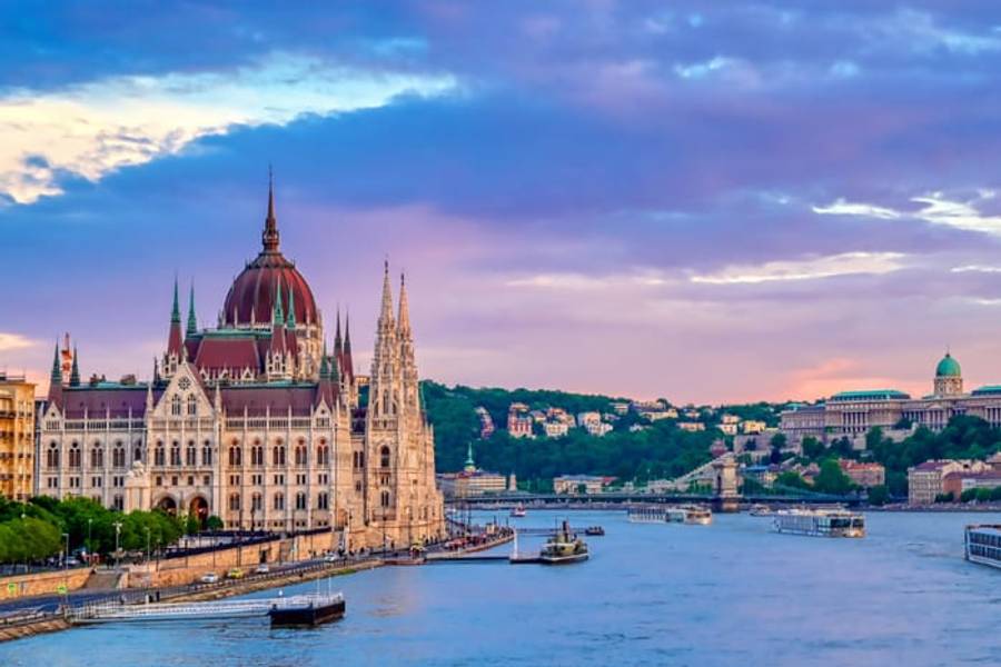 The Hungarian Parliament and Buda Castle along the Danube at sunset, Budapest, Hungary